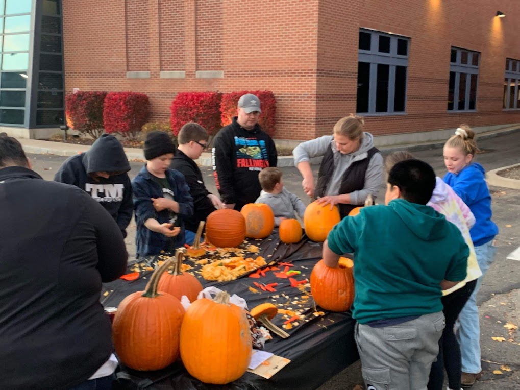 LPP students and team carving pumpkins